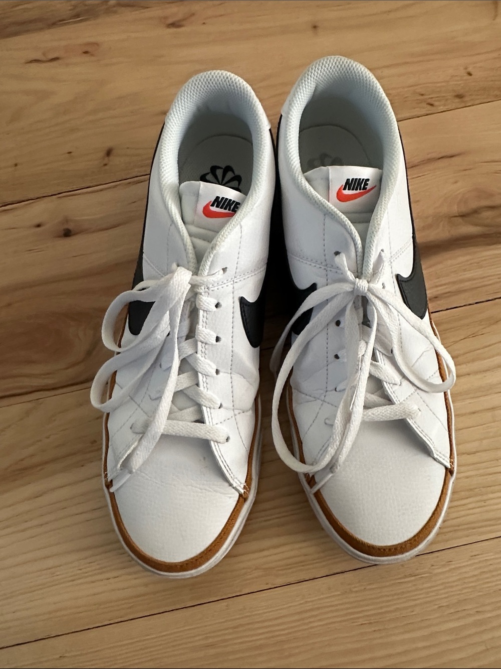 Nike White Sneakers with Black Swoosh and Brown Trim